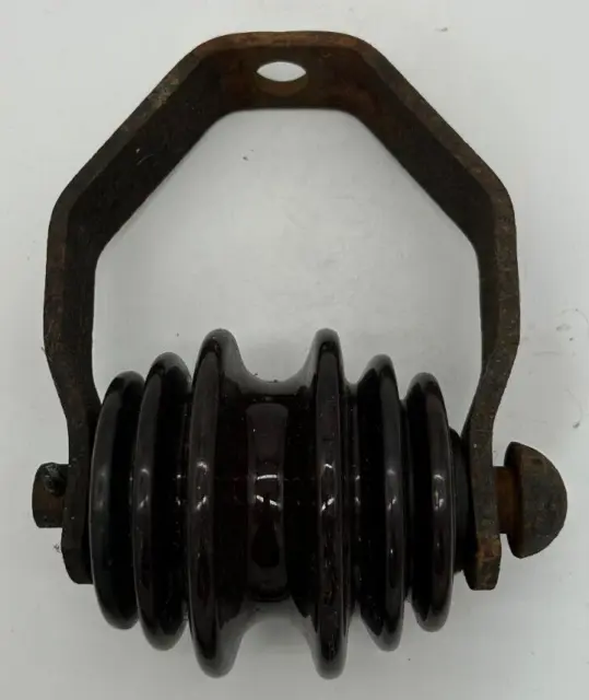 Brown porcelain roller / spool insulator on bracket - unmarked