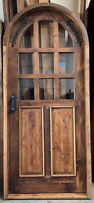 Rustic reclaimed lumber arched top door solid wood story book winery glass grids
