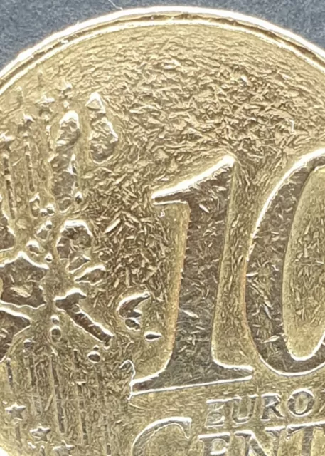 moneda única 10 céntimos de euro Francia 2001 con error, con el fondo granulado.