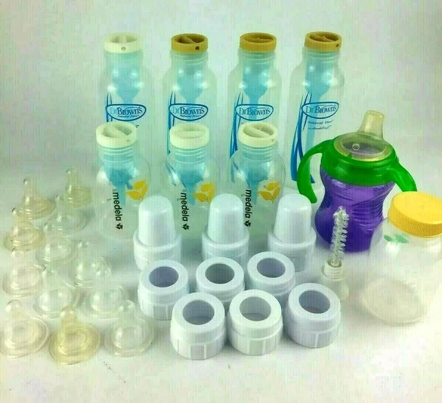 4 Dr. Brown's Natural Flow 9 oz Bottles and 4 Medela 5 oz w/extras