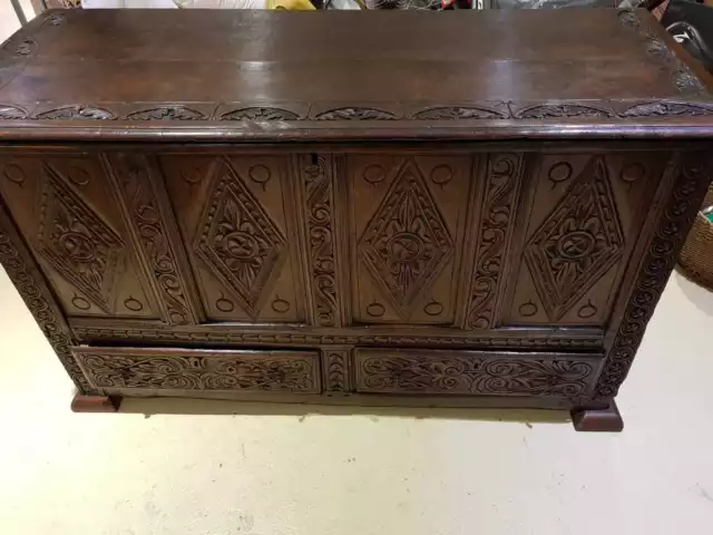 Early 18th Century Queen Anne carved and paneled oak mule chest.