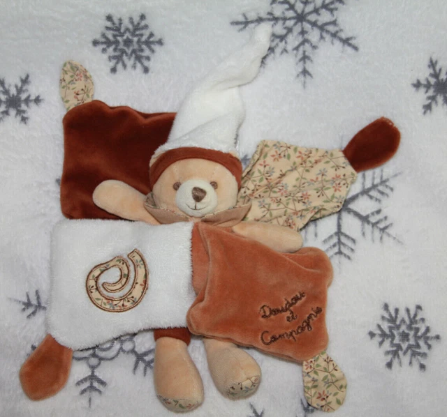 DOUDOU ET COMPAGNIE OURS  plat BONNET BLANC MARRON FLEUR TATOO TBE