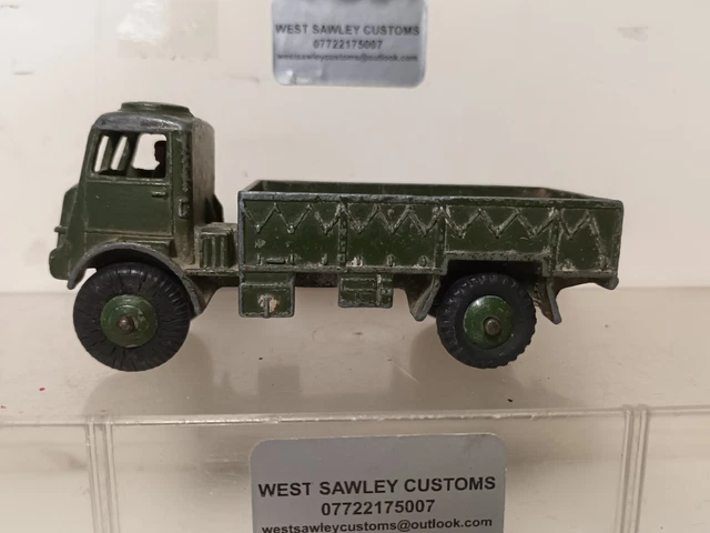 A Dinky Toys Army Covered Wagon, no. 623; a Dinky Toys 3-Ton Army Wagon no. 621; a Dinky Toys Armour