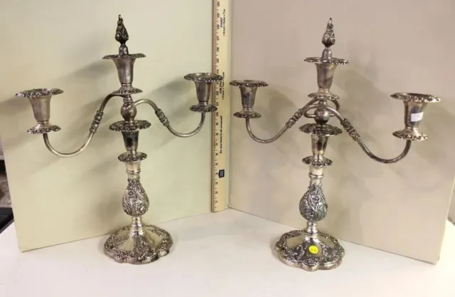 Pair of elaborate carved 3 burner silverplate candle sticks, good shape. 16"w x