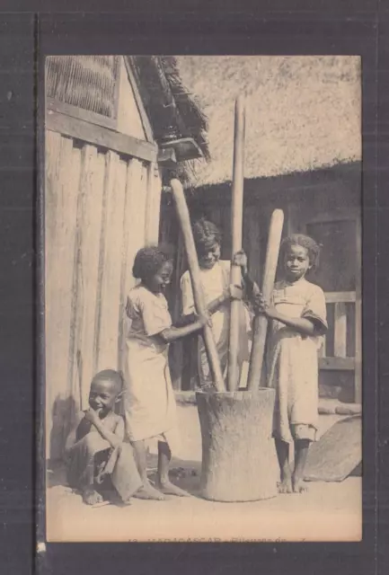 NORTH AFRICA, GIRLS POUNDING GRAIN, c1925 ppc., unused.