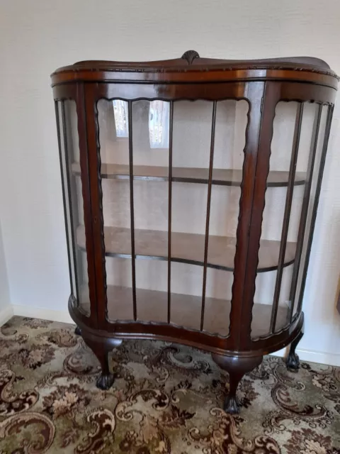 Bow fronted display cabinet with glass door