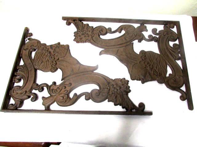 unusual pair of cast iron wall brackets