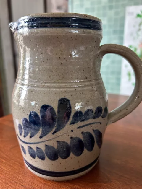 salt-glazed pottery pitcher with blue feather design signed Westerwald