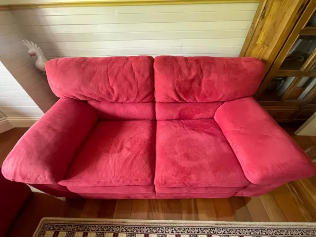 red suede lounges 2 x 2 1/2 seaters. Soft plush  dry comfy, as new condition