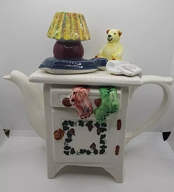 Teapot, England Swineside Ceramics. Cabinet w/ Hot water Bottle, Teddy and Lamp