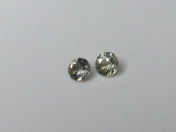 2.6 mm - 3 mm green sapphire gemstones x 2