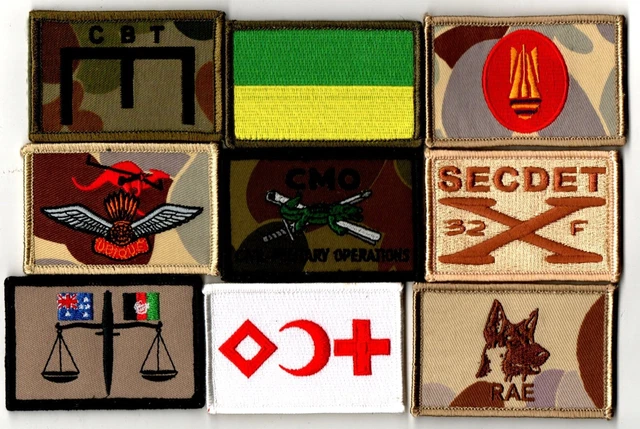 A selection of various Military cloth badges, shoulder titles, formation signs etc