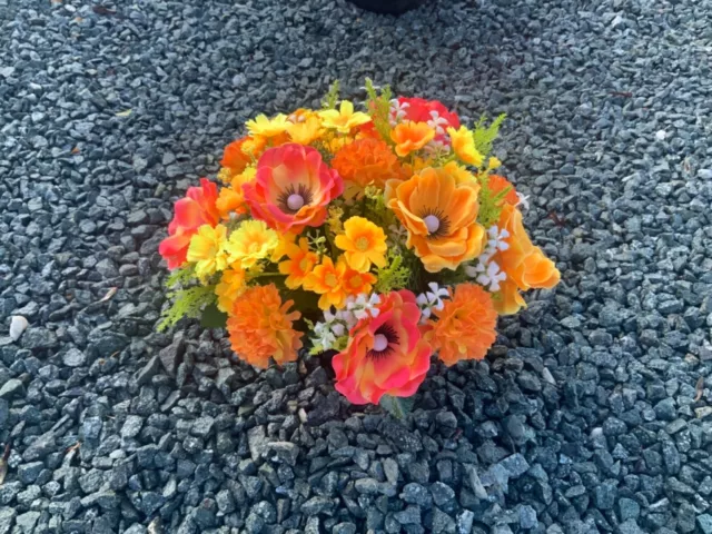 artificial orange anemone flower  arrangement in grave/memorial/crem pot