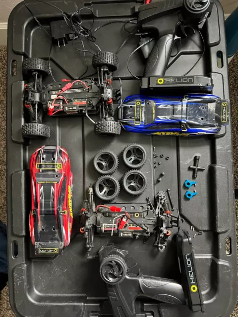 Helion Animus RC cars.  One is complete One is for parts/repair.  2 Controllers.