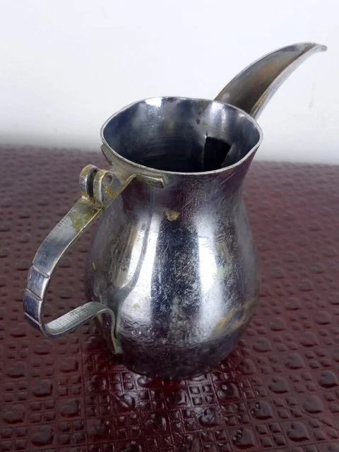 A very old silver plated stainless steel jug. A gift for antiques and antiquitie