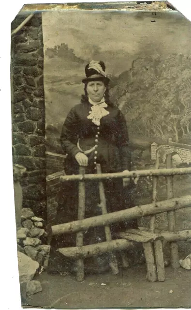 Tintype photographic portrait of a woman in a makeshift studio, circa 1880s