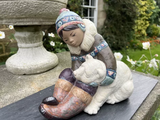 Lladro eskimo boy with polar shop bear cub