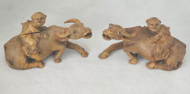 Antique Pair of Chinese Wooden Carvings of Boys Seated on Water Buffalo