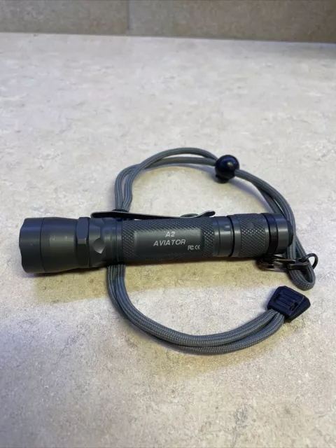 Surefire A2 Aviator Green/yellow with OEM lanyard.