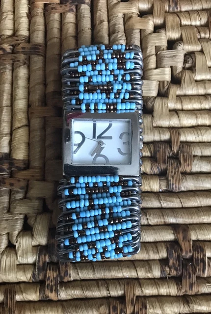 Multicolored Safety Pin Watch Quartz Movt band is stretchable to fit most.