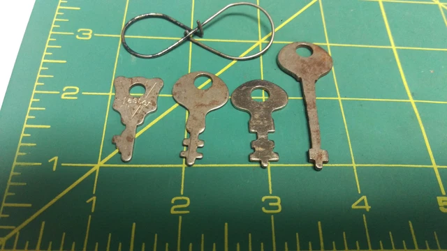 Set of 4 keys on nifty old ring - One looks like a home made flat skeleton key