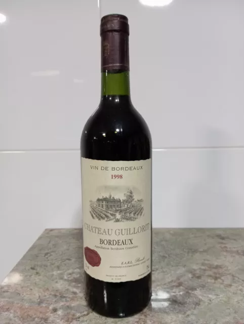 ...Botella de vino Francés. Chateau Guillorit 1998.