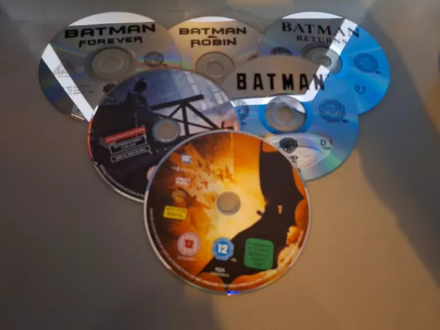 Six Batman DVD Discs. Begins / Dark Knight / Batman / Forever / Robin / Returns