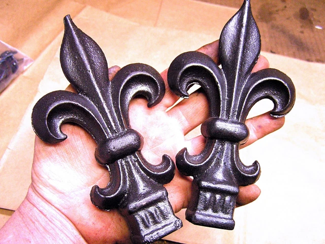 TWO cast iron Fleur De Lis finials rubbed bronze black steel finish