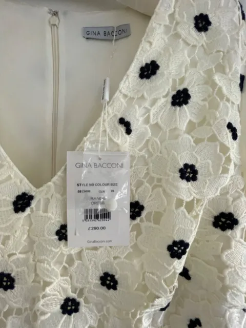 Gina Bacconi Ivory Dress with Ivory & Navy Flower Overlay. Ivory Chiffon Sleeve