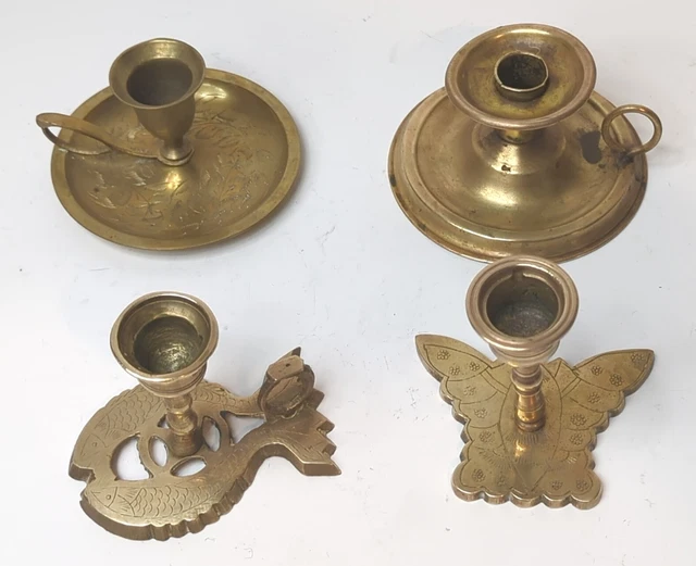 Lot of four vintage  etched candlesticks solid  brass. A fish, butterfly, floral