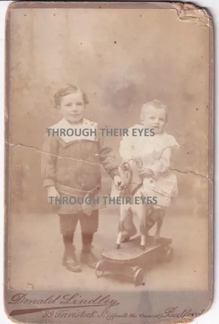 Viictorian / Edwardian photo young child & baby on pull along toy horse c 1900