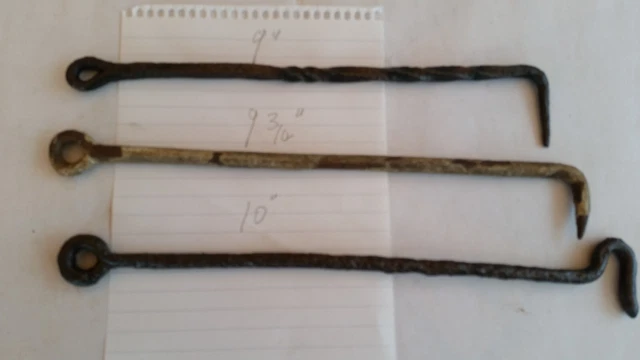Three antique iron window stays