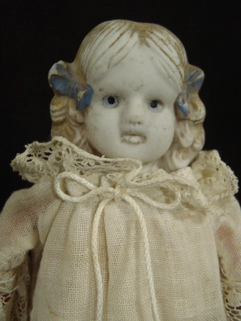 Very rare Nippon era (1891-1921) Sculptured hair bisque doll on Red cloth body