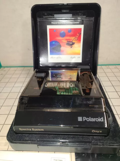 Cámara fotográfica instantánea transparente vintage Polaroid Spectra System ONYX con papeles