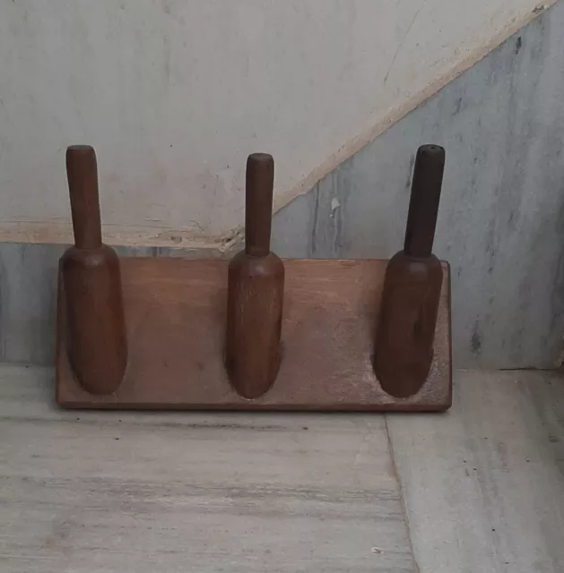 Old vintage wooden coat hangers handmade brown wall hooks indian clothes shelf