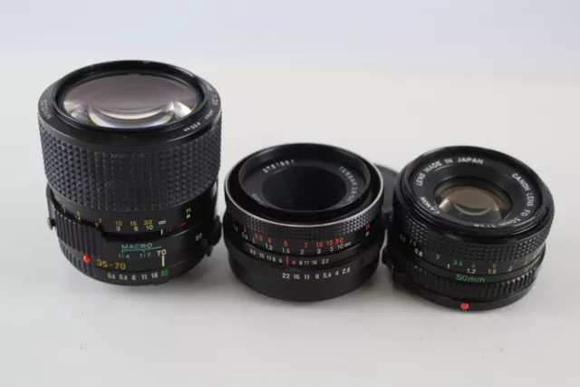 3 x CAMERA LENSES Inc. Canon, Minolta & Carl Zeiss w/ Caps Mechanically WORKING