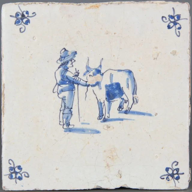 Nice Dutch Delft Blue tile, figure with cow, second half 17th. century.