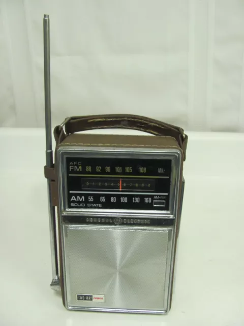 Vintage General Electric AM/FM radio with brown leather case model P977E