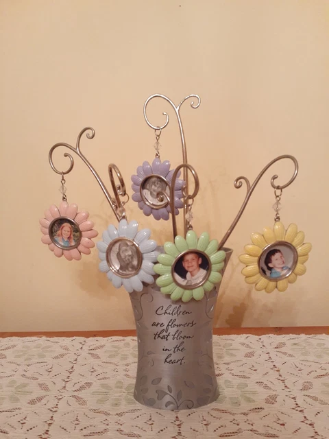 Pewter Vase With Beautiful Pastel Flower Shaped Picture Frames With Stems.