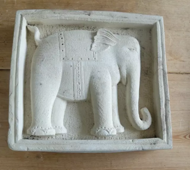 Carved stone relief garden wall plaque of elephant. Signed tc. Circa 1999