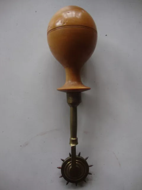 Lovely tactile treen boxwood handled parchment runner or scriveners wheel