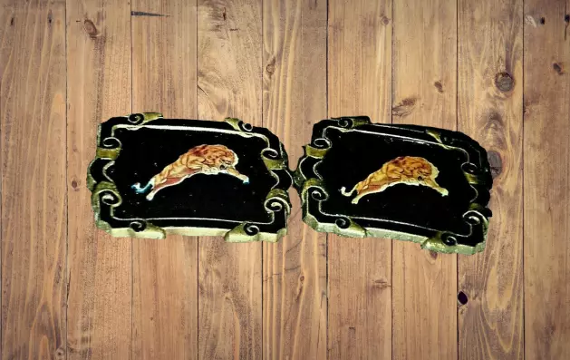 lot of 2 running tiger belt buckle with black background