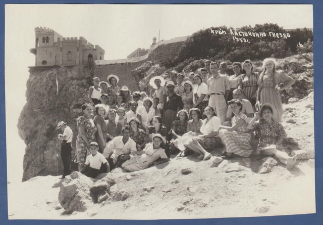 Beautiful guys and girls on the mountain near the castle. Vintage Photo USSR
