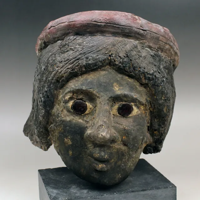Romano-Egyptian cartonnage mummy mask depicting a female head linen gesso