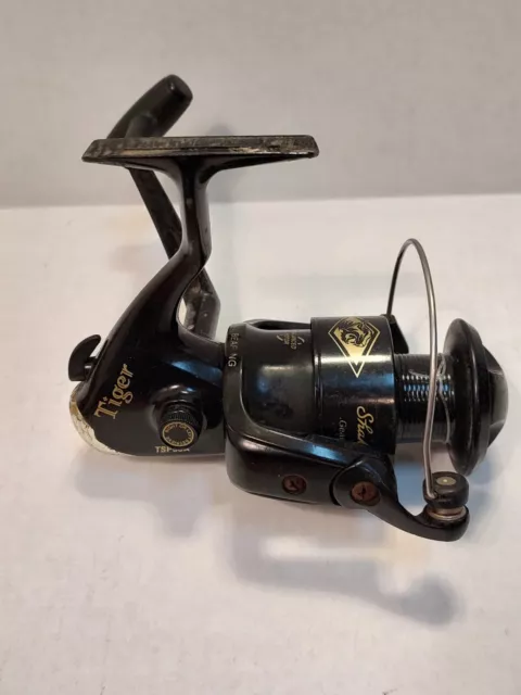 https://www.picclickimg.com/wiAAAOSwh2pkdhEC/Shakespeare-Tiger-Spinning-Fishing-Reel-TSP50A.webp