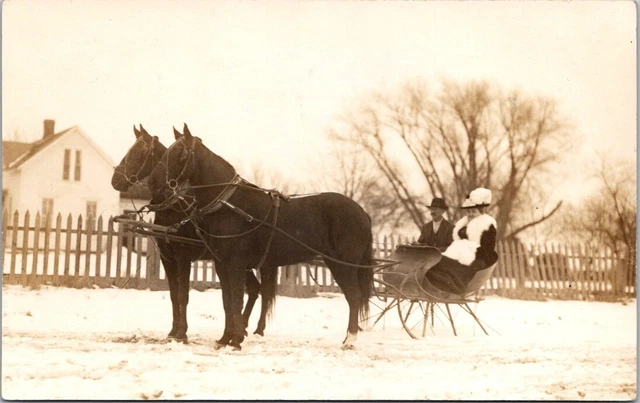RPPC Horse Drawn Sleigh Snow Woman Fur Muff Hat Man AZ0 c1910 photo postcard GP2
