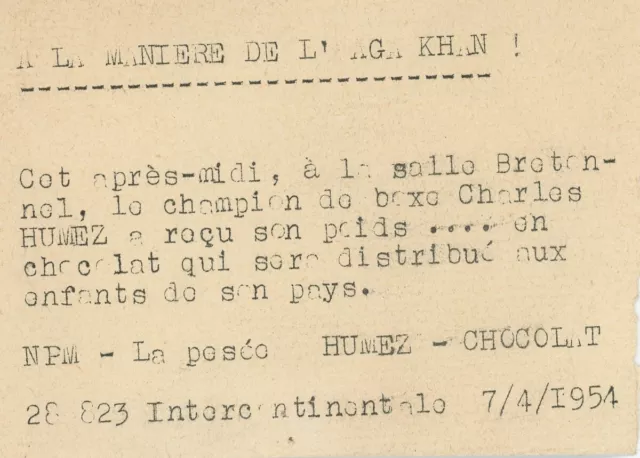 Le champion de boxe Charles Humez a reçu son poids en chocolat. Sport. 1954. 2