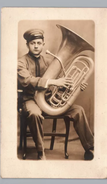 MAN WITH TUBA antique real photo postcard rppc fireman? marching band orchestra