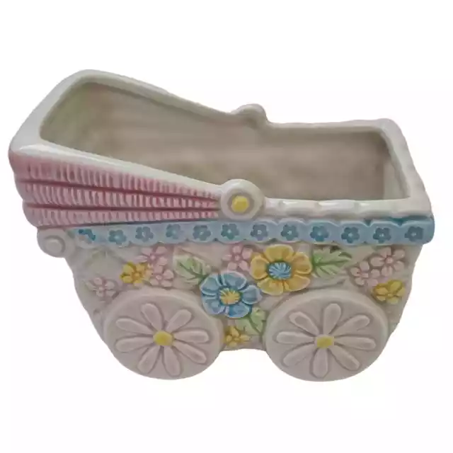 Vintage baby buggy ceramic planter container.