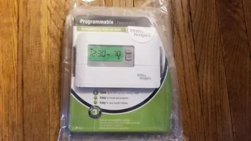 White Rogers programable air wall thermostat backlight model P200 heat cool